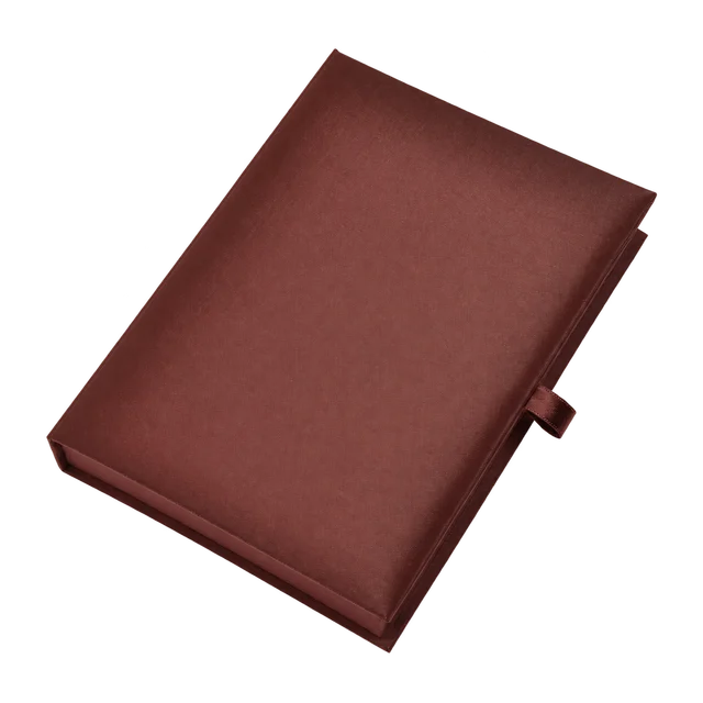 Cocoa-brown silk invitation box with a closed lid and ribbon pull tab
