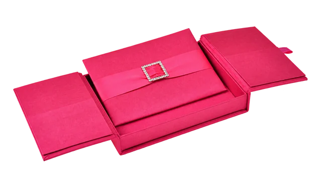 Vivid pink gatefold silk invitation box with a ribbon and crystal detail